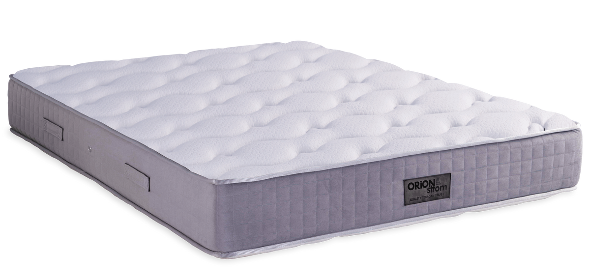 7004 Filoxenia Energy Hyper Soft Plus High Pocket — Angled view: white quilted surface and a grey border with finished edges. Feel: soft. Anatomical mattress.