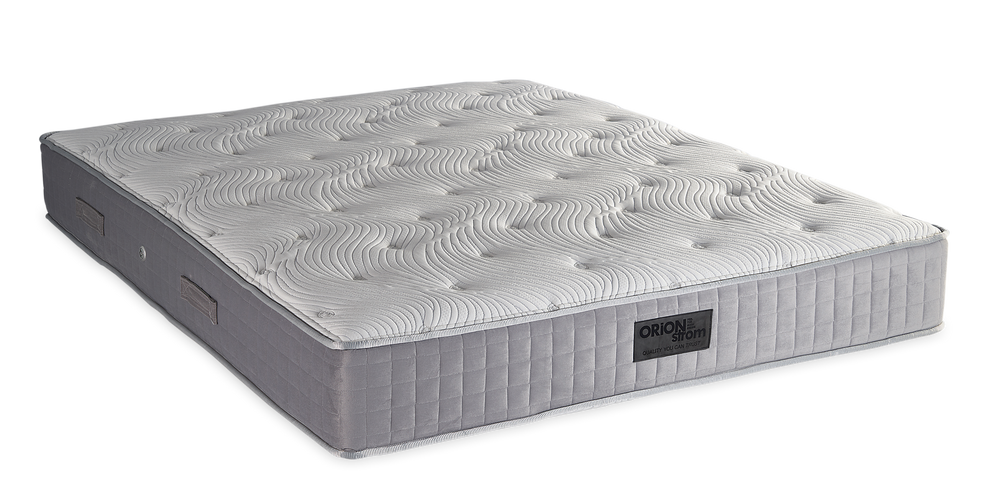 759 Filoxenia Hypnos Cotton Latex HR — Angled view: white textured quilting and a grey fabric border with vertical stitching. Feel: medium-firm. Orthopaedic mattress.