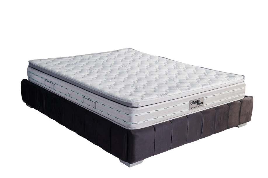 7601 Filoxenia Silver Extra Plus G-Pillowtop — Angled view: white quilted mattress shown on a dark upholstered base. Feel: medium-firm. Anatomical mattress.