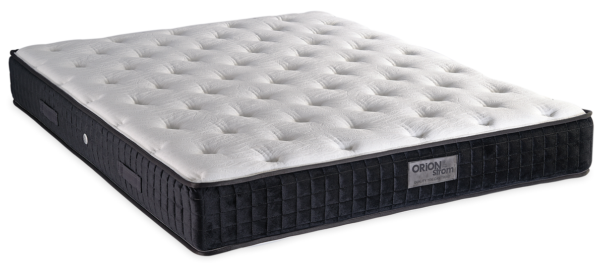 815 Filoxenia Silk Cool Max Hyper Soft Plus Pocket — Angled view: white deeply quilted top and a black border with vertical stitching. Feel: soft. Anatomical mattress.