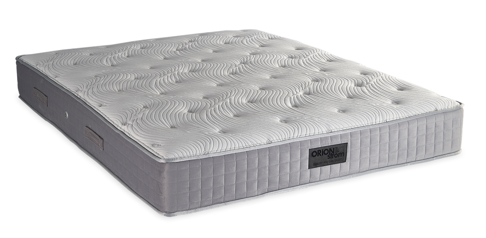 839 Filoxenia Hypnos Cotton Latex HR Orion Zone Pocket — Angled view: white textured quilting and a grey fabric border with vertical stitching. Feel: medium-firm. Anatomical mattress.