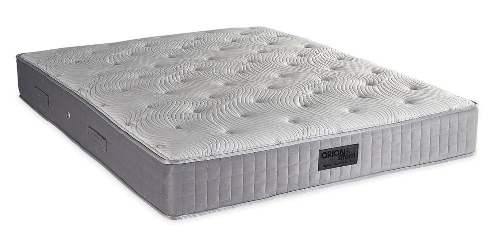 843 Filoxenia Hypnos Cotton Latex Extra Memory Gel Orion Zone Pocket — Angled view: white textured quilting and a grey fabric border with vertical stitching. Feel: medium. Anatomical mattress.