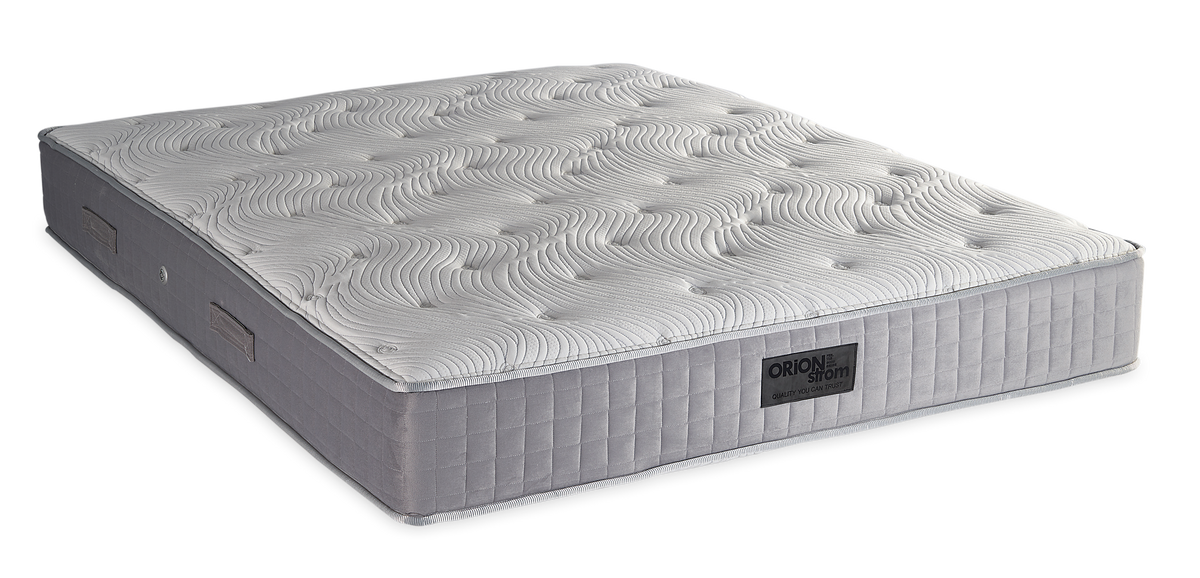 843 Filoxenia Hypnos Cotton Latex Extra Memory Gel Orion Zone Pocket — Angled view: white textured quilting and a grey fabric border with vertical stitching. Feel: medium. Anatomical mattress.