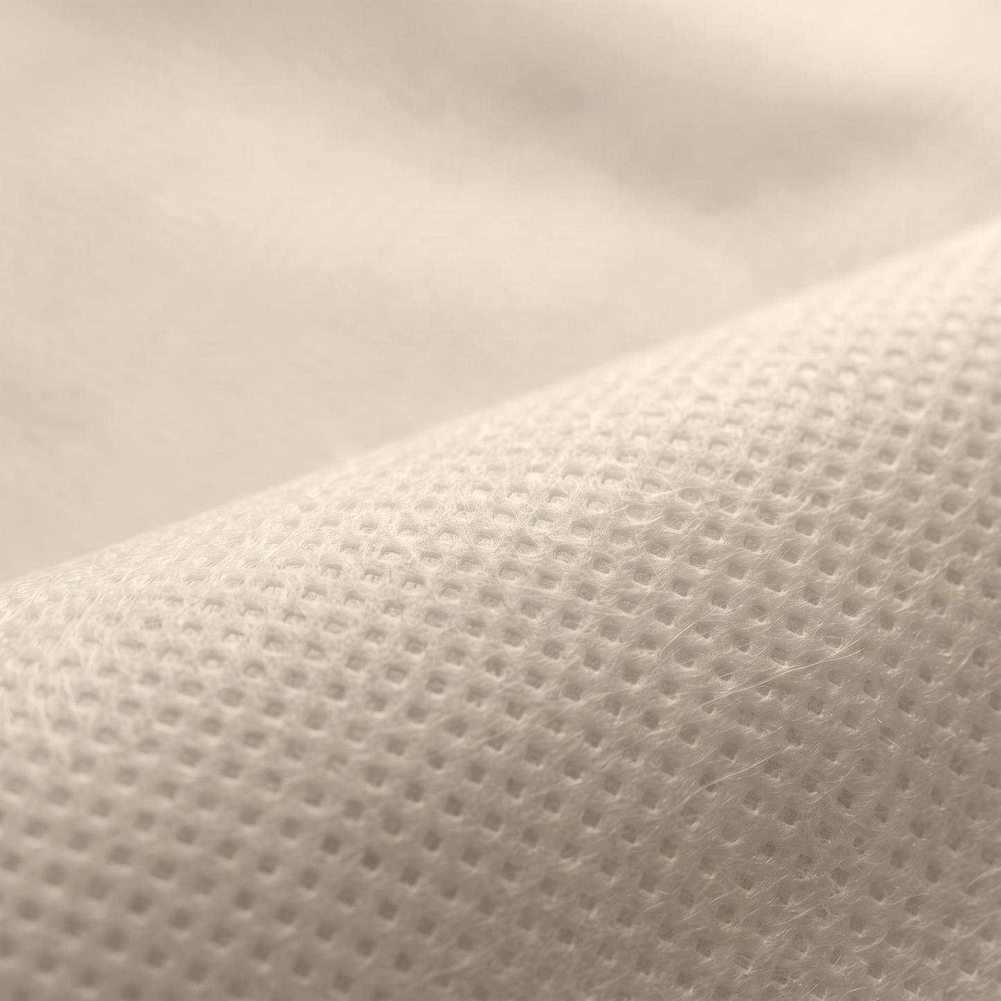 Ύφασμα NON WOVEN 70gr σε ανοιχτό μπεζ, διαθέσιμο σε πλάτος 160cm, για επενδύσεις και διακοσμητικές εφαρμογές.