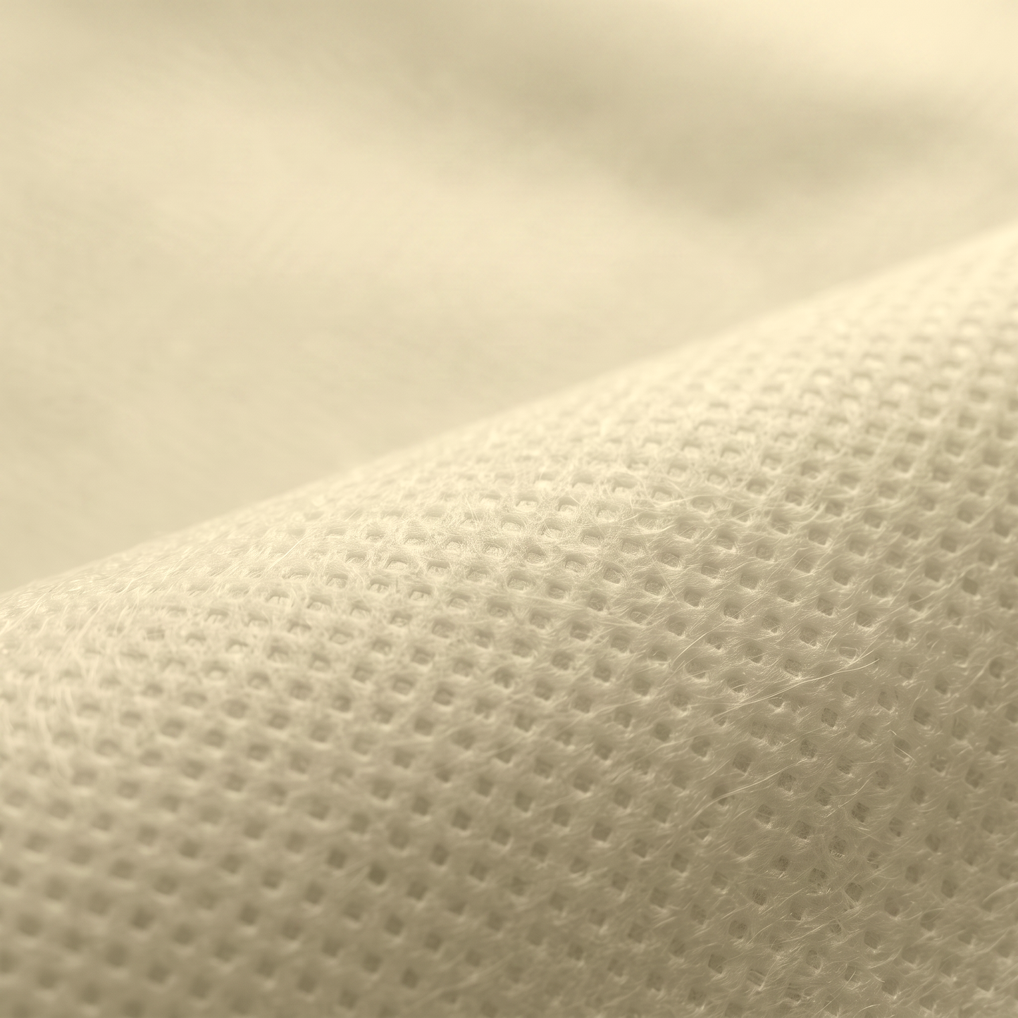 Ύφασμα NON WOVEN 70gr σε εκρού κίτρινο, διαθέσιμο σε πλάτος 160cm, για επενδύσεις και διακοσμητικές εφαρμογές.